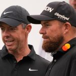 Rory McIlroy, of North Ireland, talks with teammate Shane Lowry, of Ireland, right, on the 12th green during the first round of the PGA Zurich Classic golf tournament at TPC Louisiana in Avondale, La., Thursday, April 24, 2025. (AP Photo/Gerald Herbert)